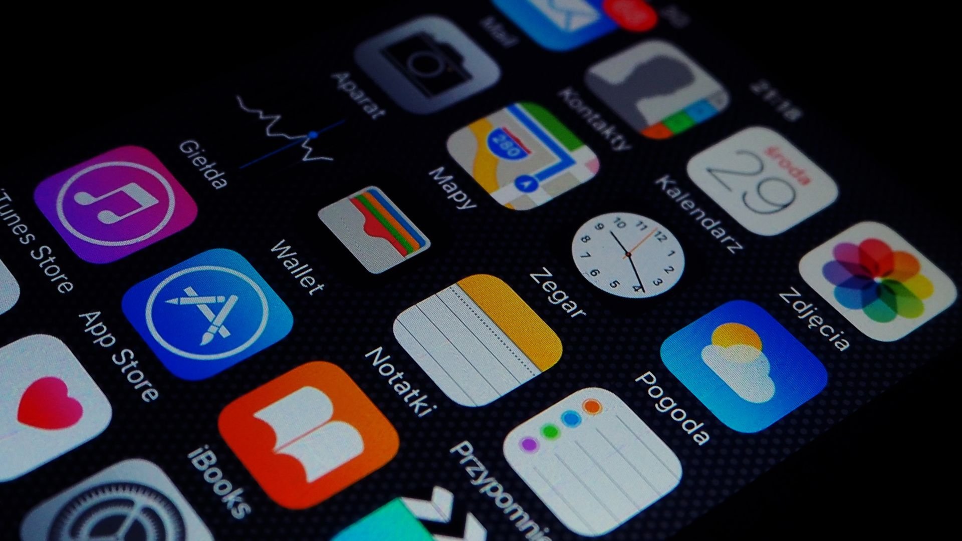 Smartphone screen showing colorful app icons on a black background